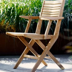 Chaise de jardin avec accoudoirs pliable en teck Flip - Cane-Line