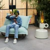 Fauteuil à bascule extérieur en métal noir avec coussin rayé orange crème Rock 'n Roll Combi - Fatboy