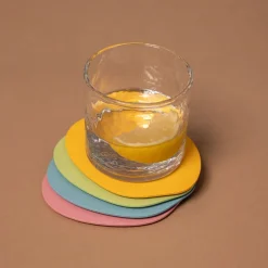 4 sous verres organiques en acier mango lassi 10x2cm Kiva - Metallbude