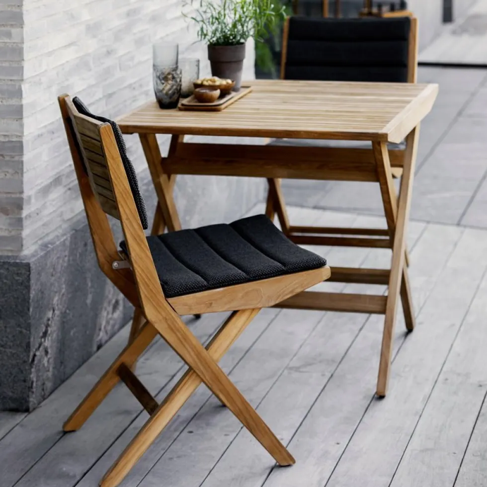 Table de jardin carrée en teck Flip - Cane-Line